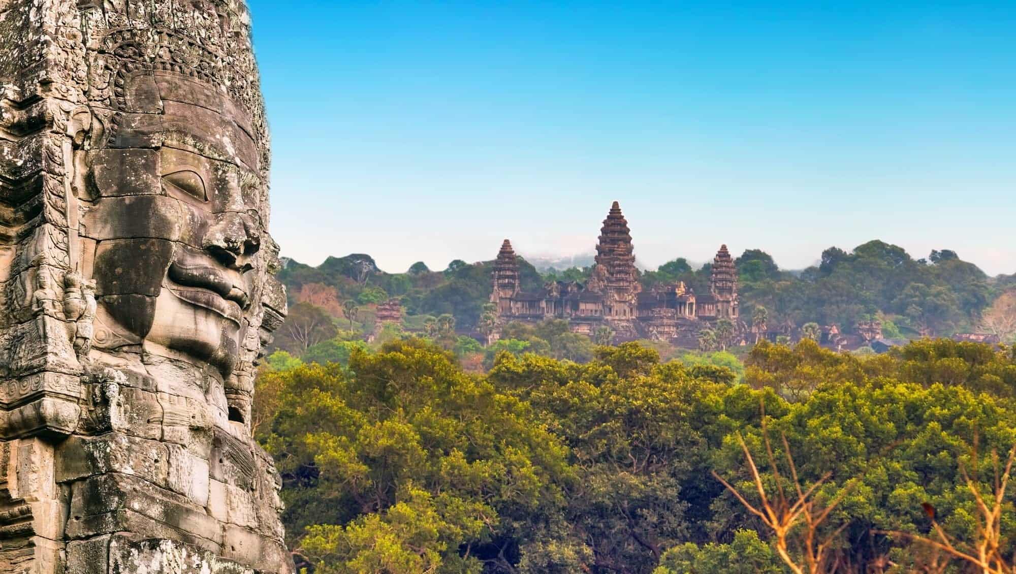 Ancient stone faces of king Bayon Angkor Wat, Siem Reap, Cambodia. Ancient monument Khmer architecture Kampuchea.
