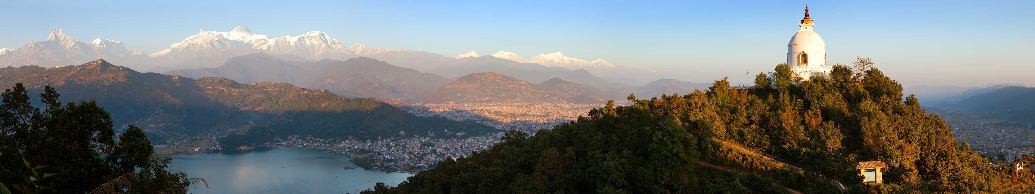 Evening panoramic view of world peace stupa, Phewa lake, Pokhara and great himalayan range, Annapurna, Manaslu, Nepal Himalayas mountains