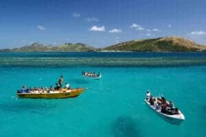 Fiji boat hover on turquiose water