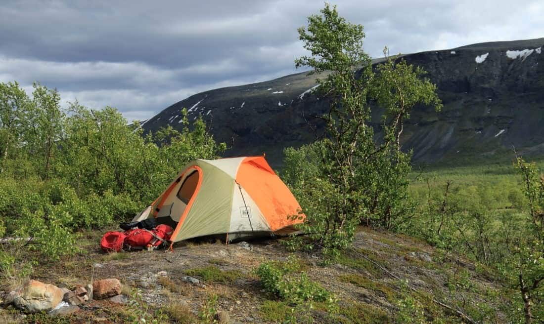 TCamping Lapland. Kungsleden trail in Sweden. The Kungsleden ("The King's Trail" or "The Trail of Kings") is one of Sweden's most famous hiking trails and runs for a total of 450 kilometres through Swedish Lapland, 200 kilometres north of the Arctic Circle.