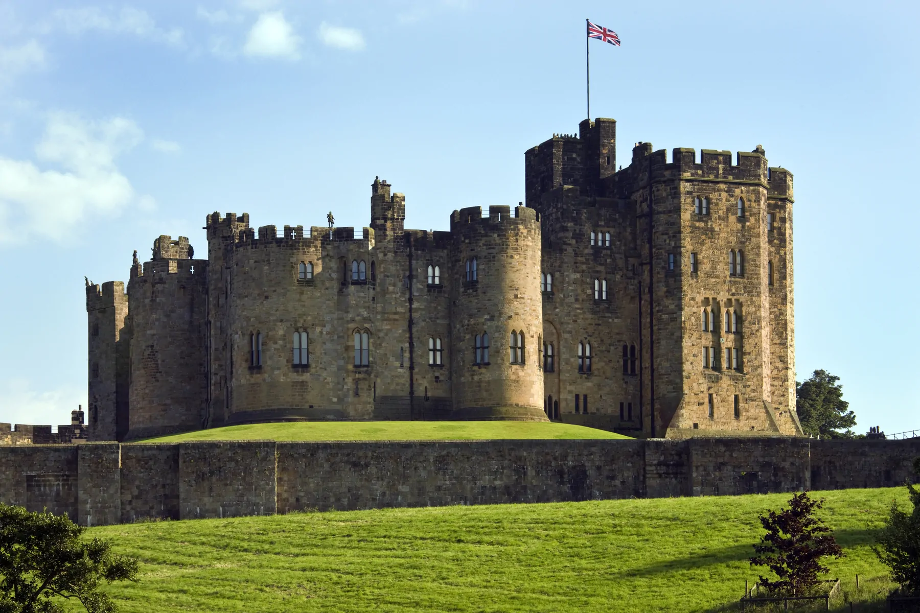 Alnwick Castle in the town of Alnwick in Northumberland in North East England. Dates from 1096AD when Yves de Vescy became Baron of Alnwick and erected the earliest parts of the castle. Since 1309 the castle has been in the hands of the Percy Family who are the Dukes and Earls of Northumberland.