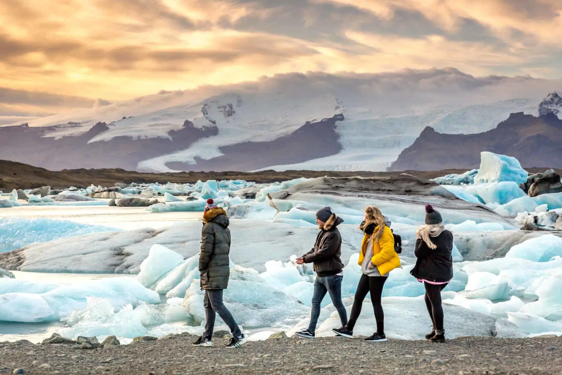 Jökulsárlón, Iceland - Nov 1st 2017 - Tourists and locals enjoying the Jökulsárlón iceberg lagoon with glacier in the background in Iceland