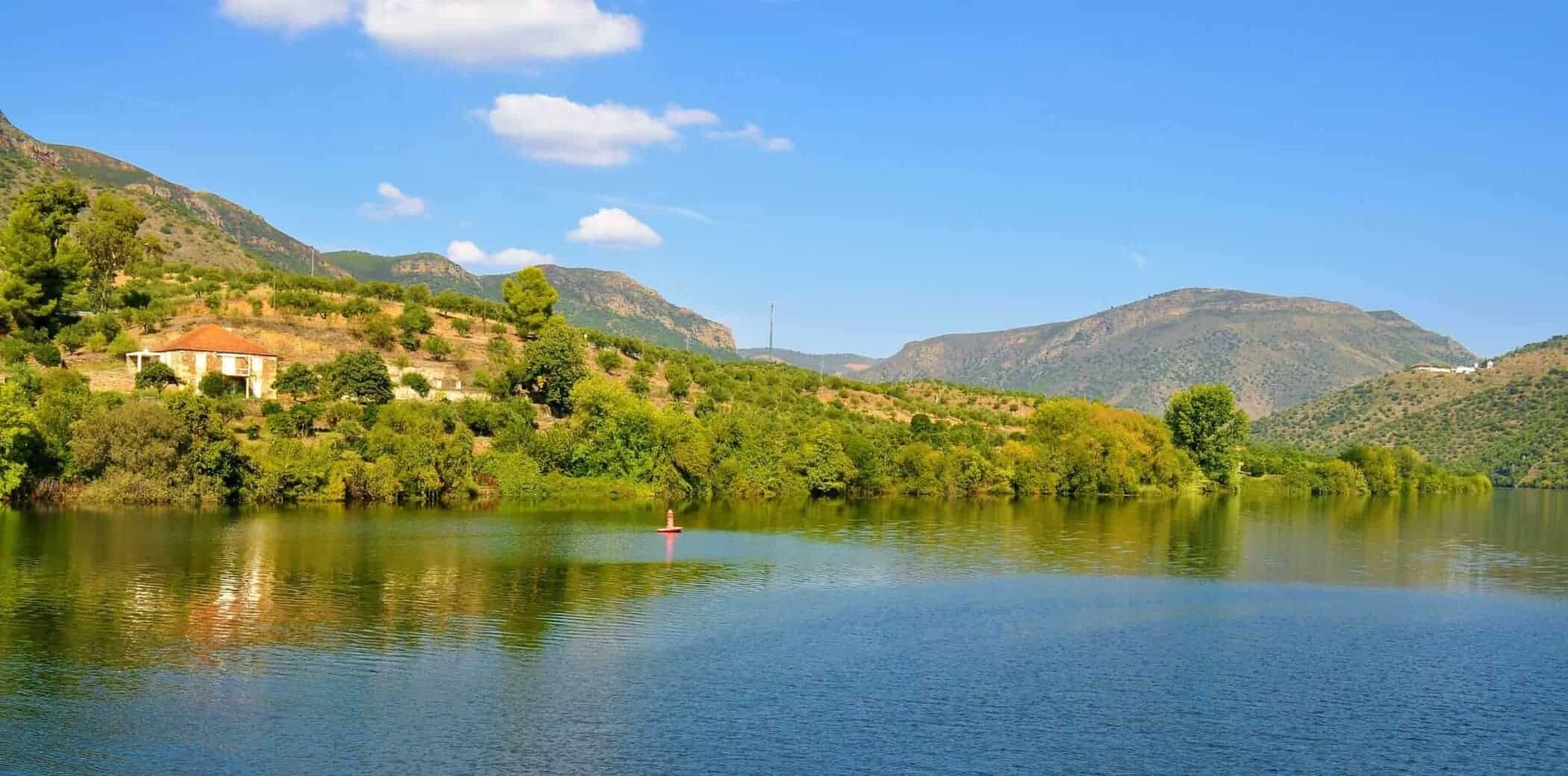 Photo of the river Douro, a house and the blue sky - Trás-os-Montes and Alto Douro Province - Portugal