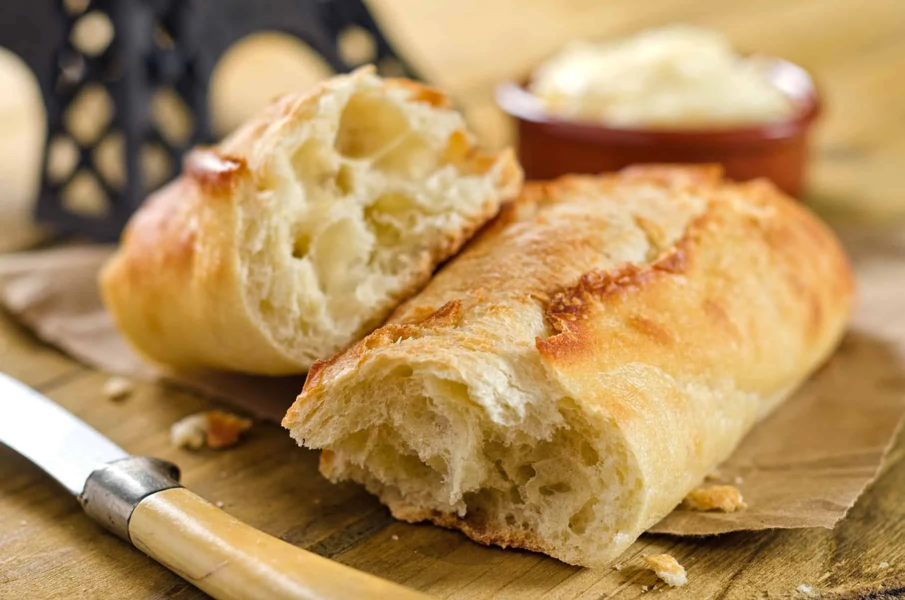 Crisp and chewy french bread baguette with butter.
