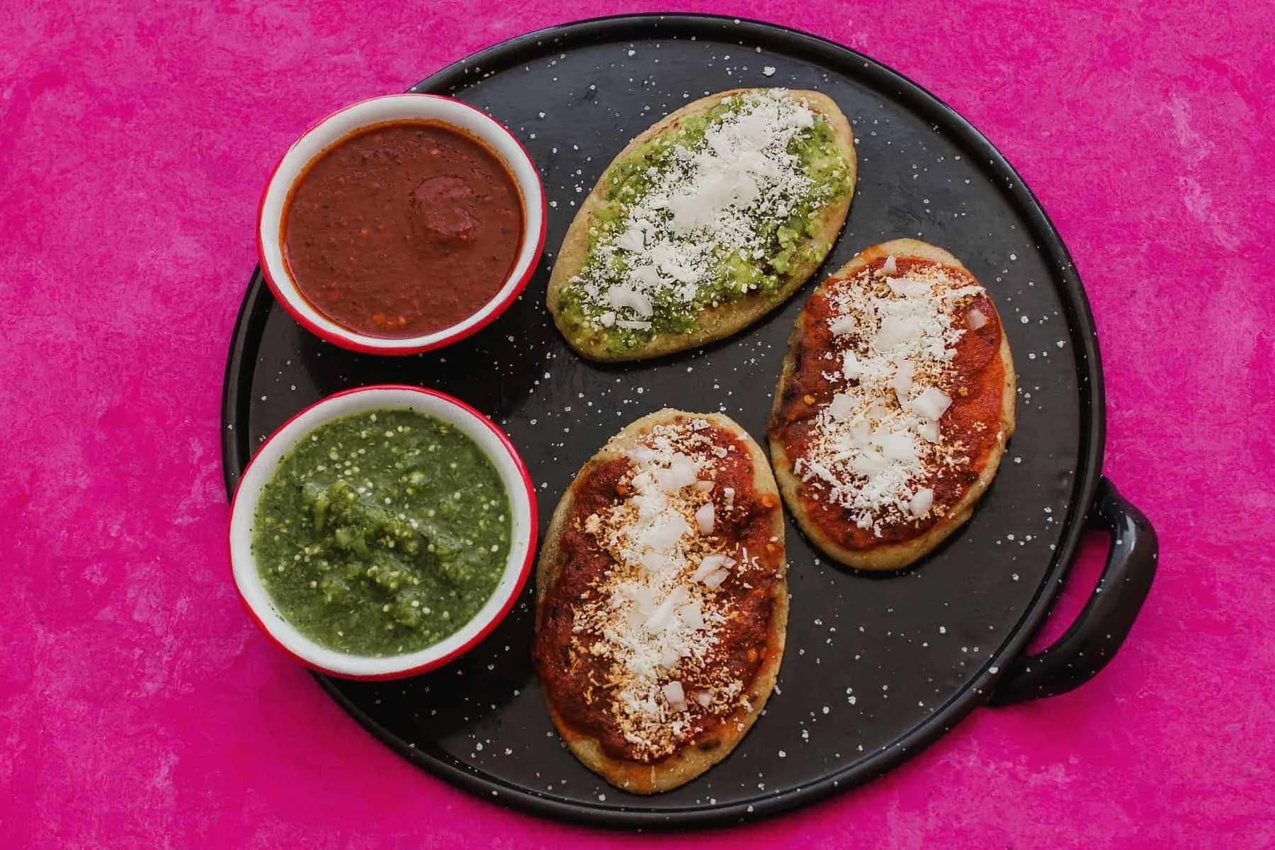 mexican tlacoyos with green and red sauce, Traditional food in Mexico