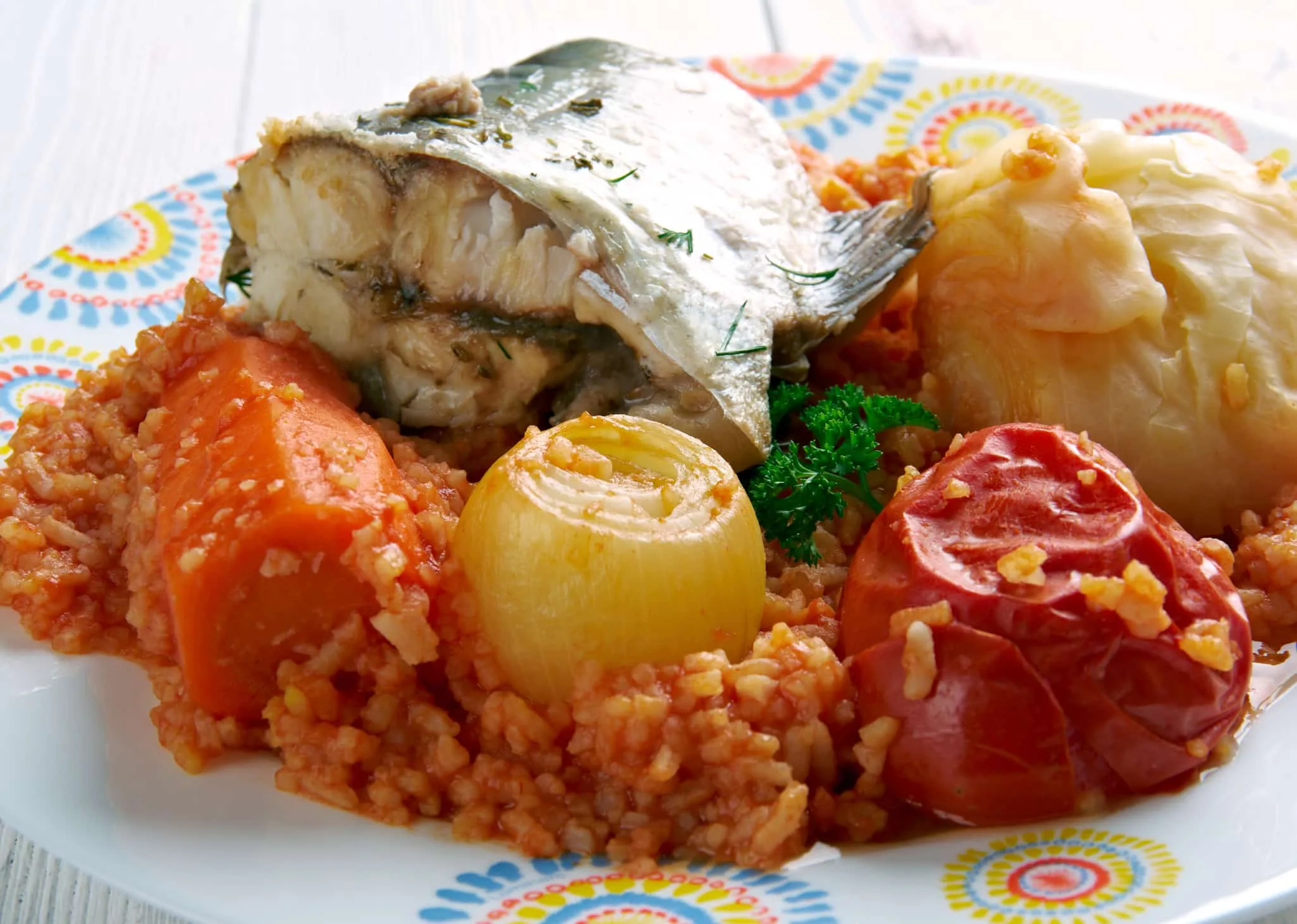 Thieboudienne - traditional dish from Senegal.made from fish, rice and tomato sauceThieboudienne - traditional dish from Senegal.made from fish, rice and tomato sauce