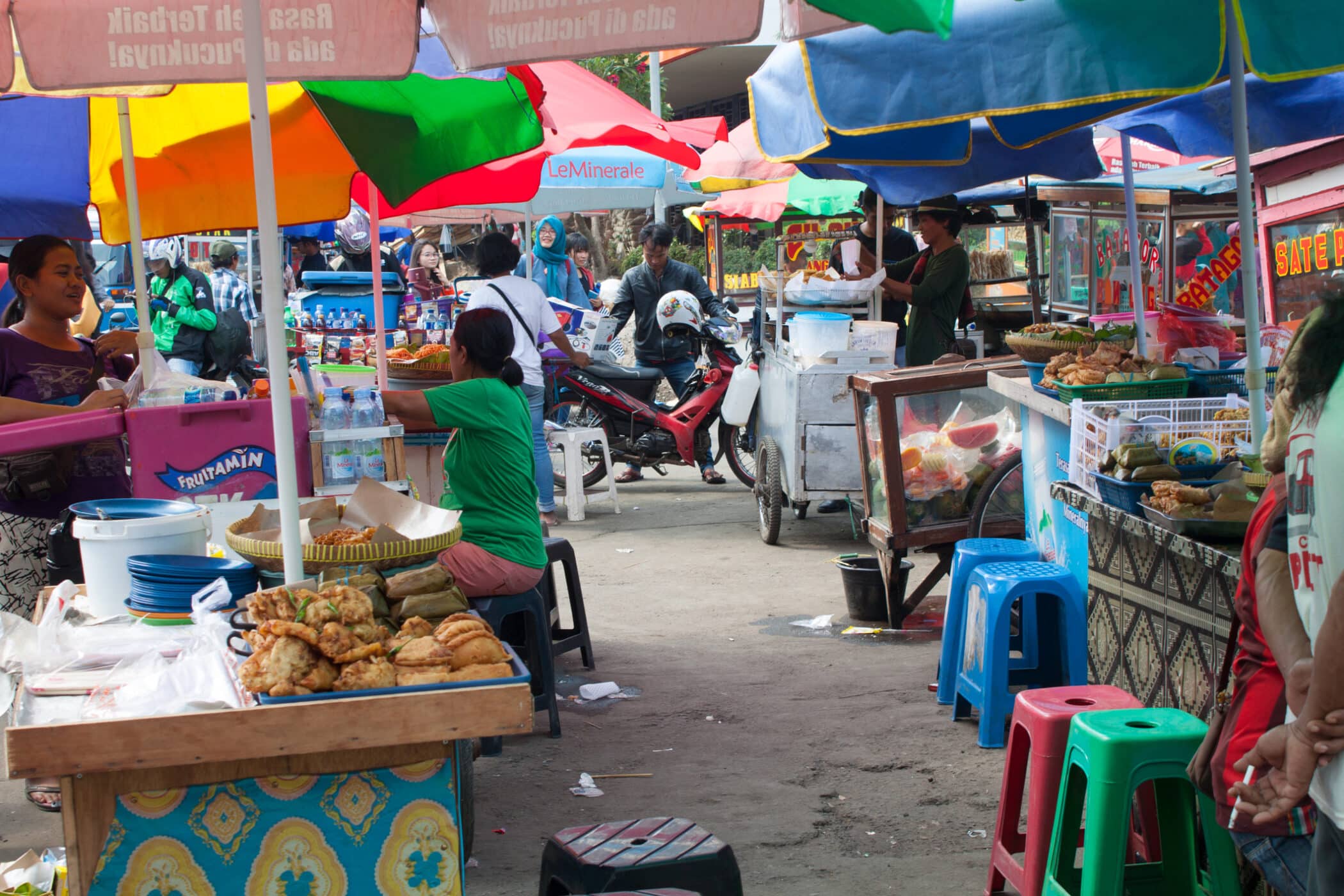 Street food vendor in Jakarta Indonesia. people selling in cart, mad i asien