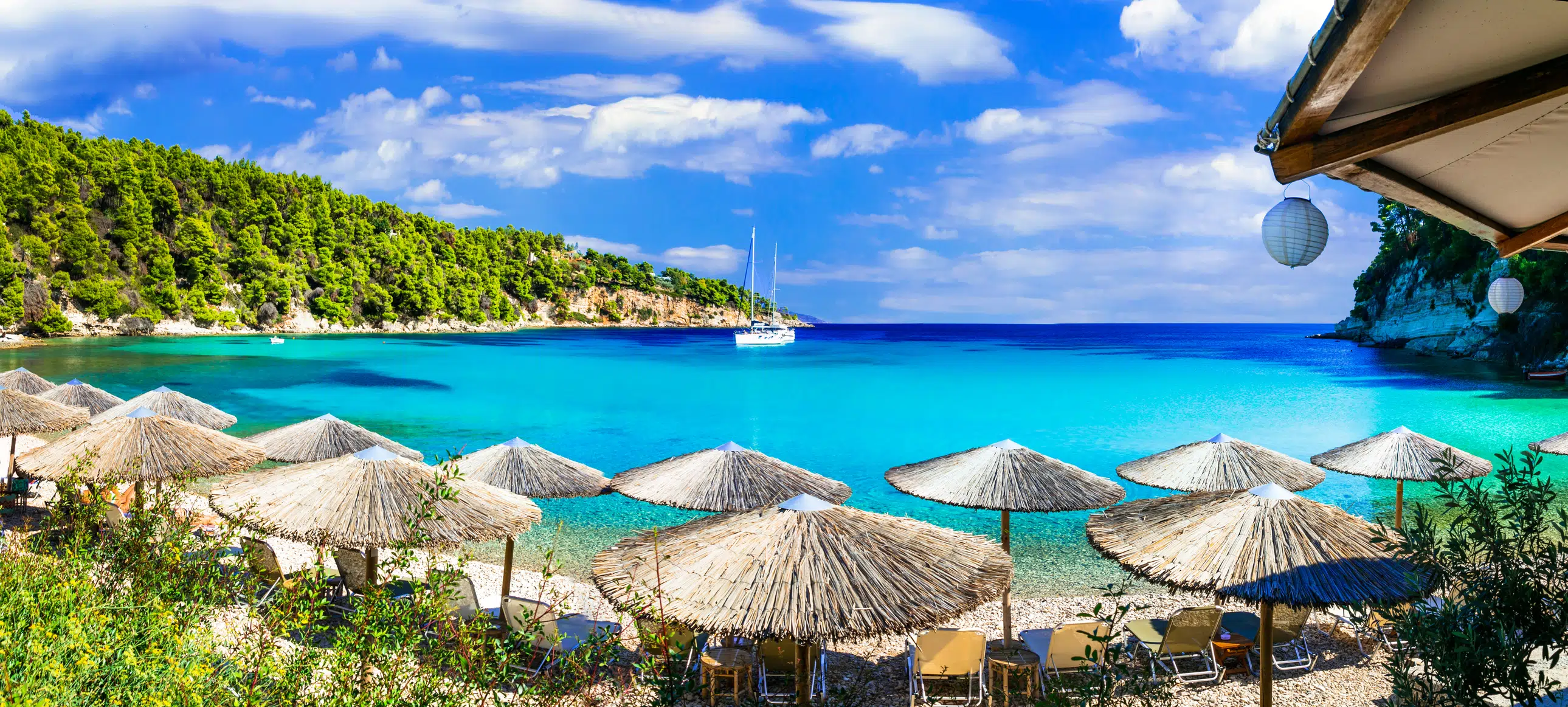Alonissos island, Greece..Milia beach ,view with azure sea ,mountains and umbrellas