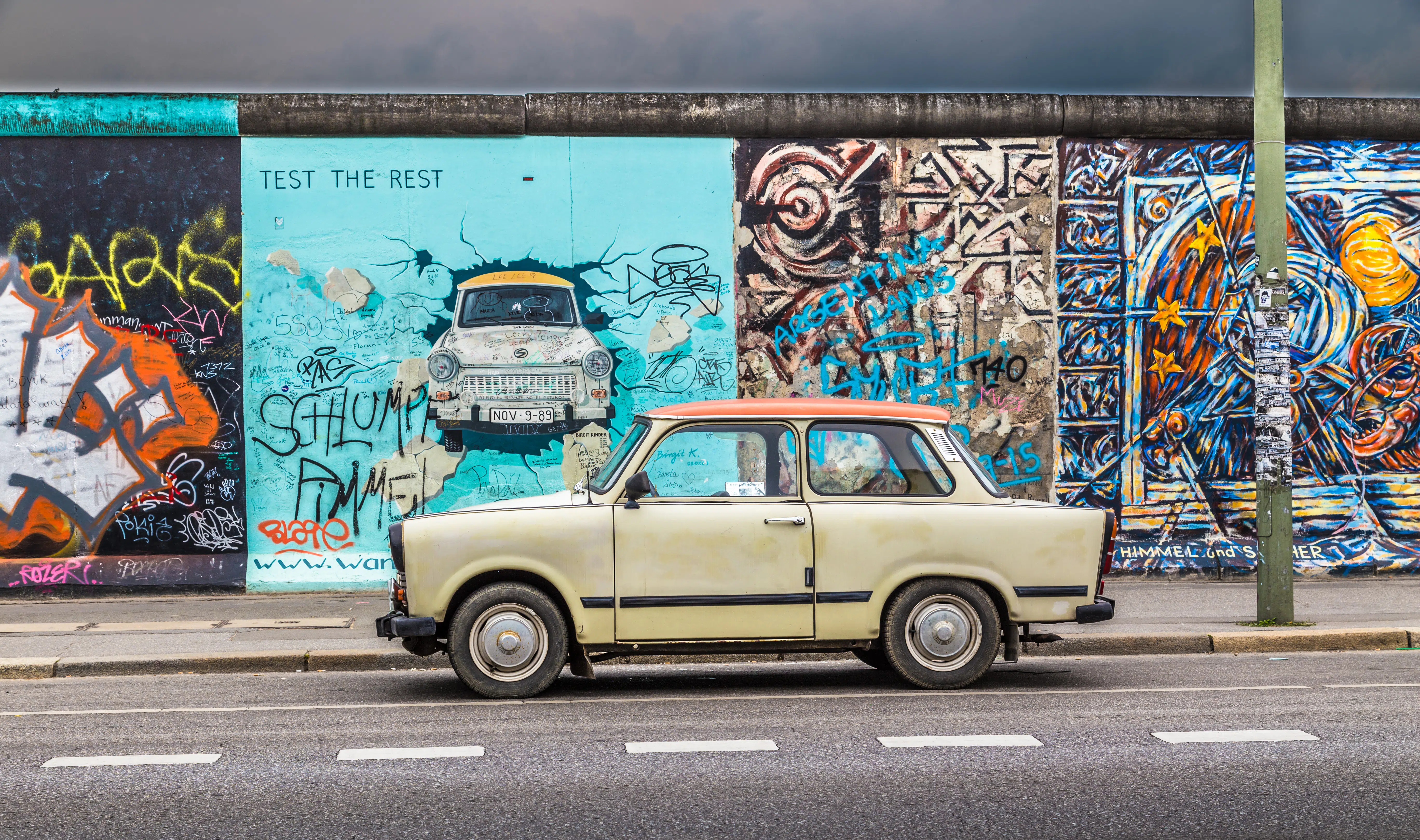 Berlin Wall at East Side Gallery with an old Trabant, Germany