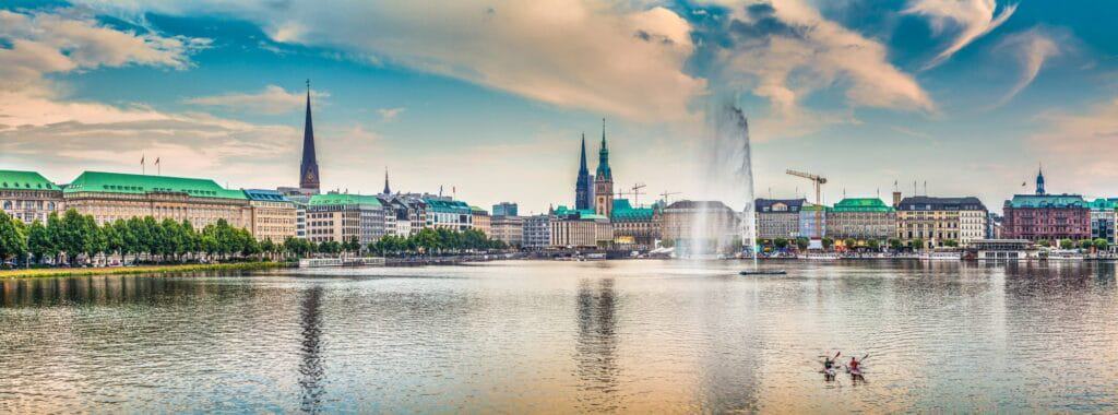 Binnenalster (Inner Alster Lake) in golden evening light at sunset, Hamburg, Germany