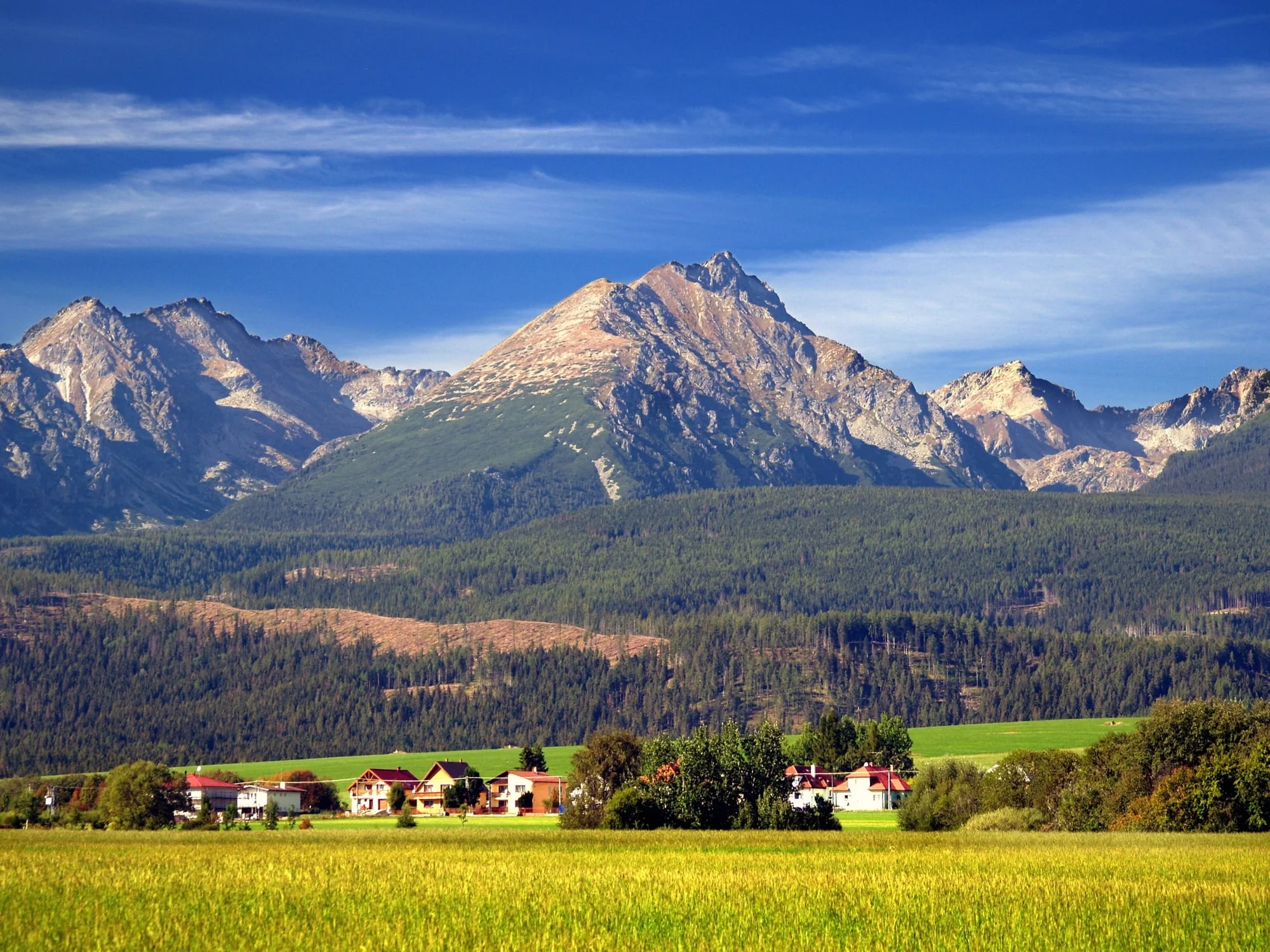 A view of The Tatra Mountains and village in summer, Slovakia.