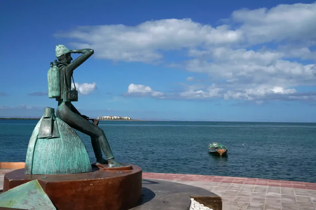 Cousteau statue in La Paz Baja California Sur, Mexico beach promenade called Malecon